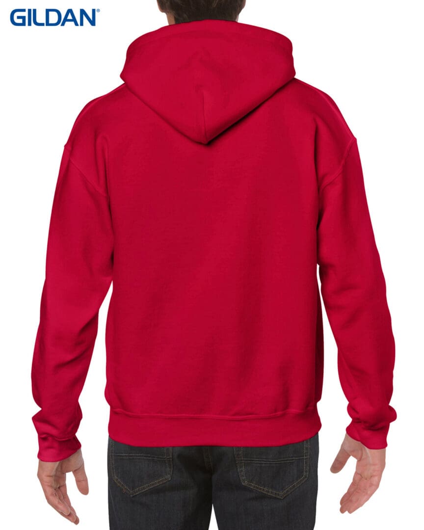 A person wearing a red hoodie with their hands on the chest.