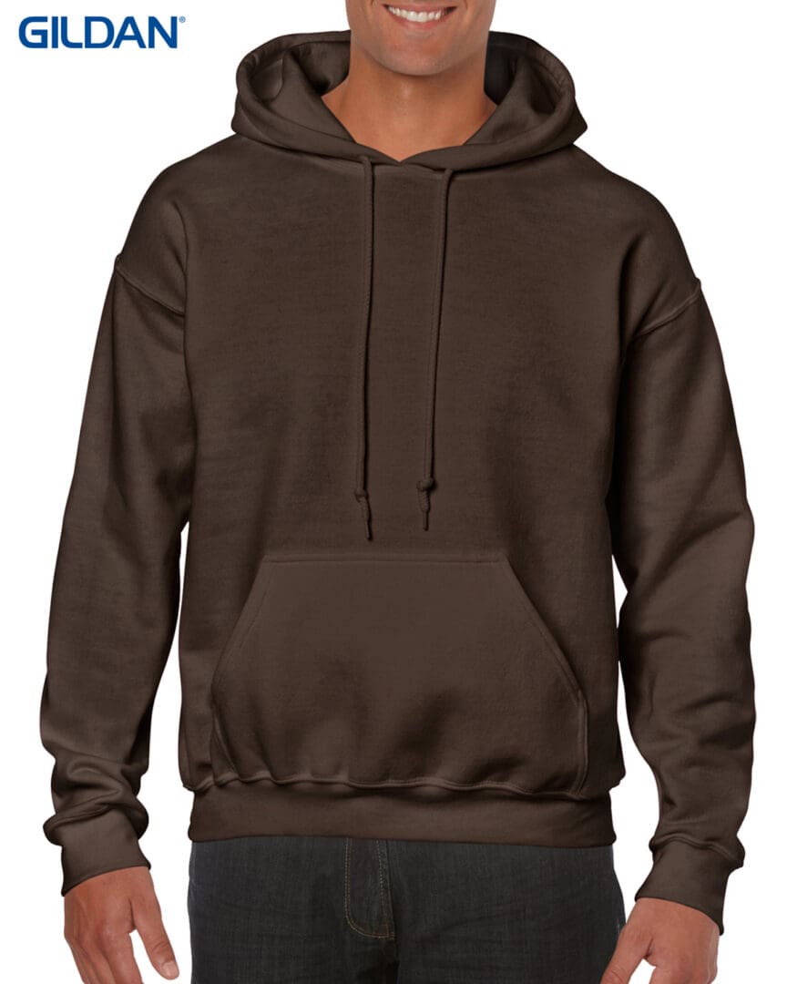 A man wearing a brown hoodie with a black background