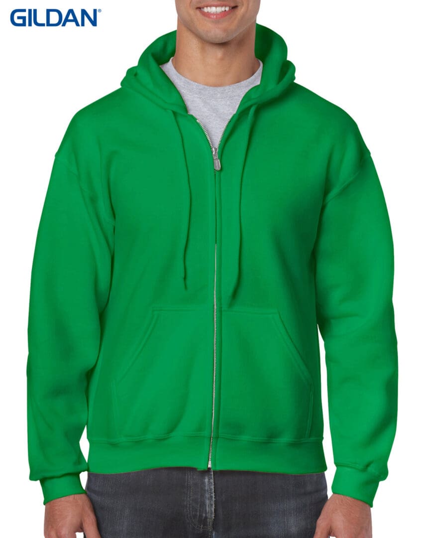 A man wearing a green hoodie with a white shirt