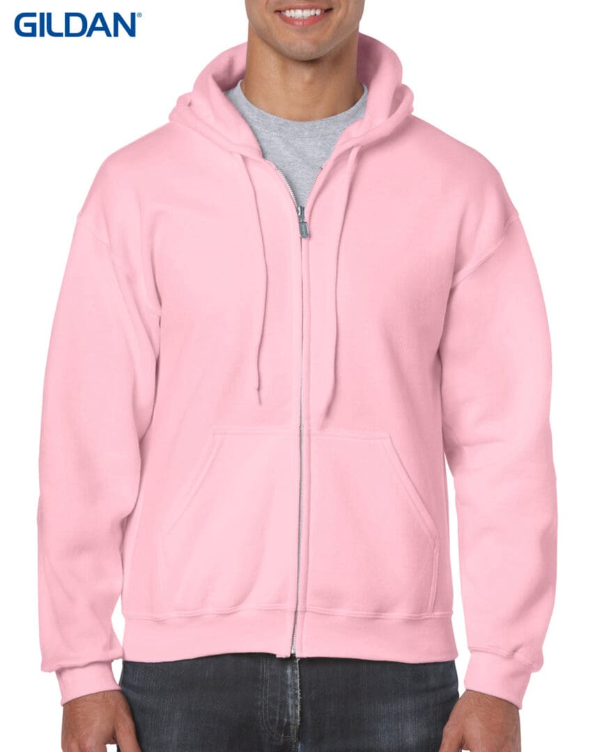 A man wearing a pink hoodie with a gray shirt.