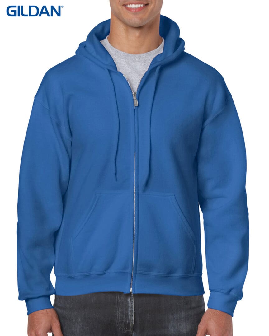 A man wearing a blue hoodie with a white background