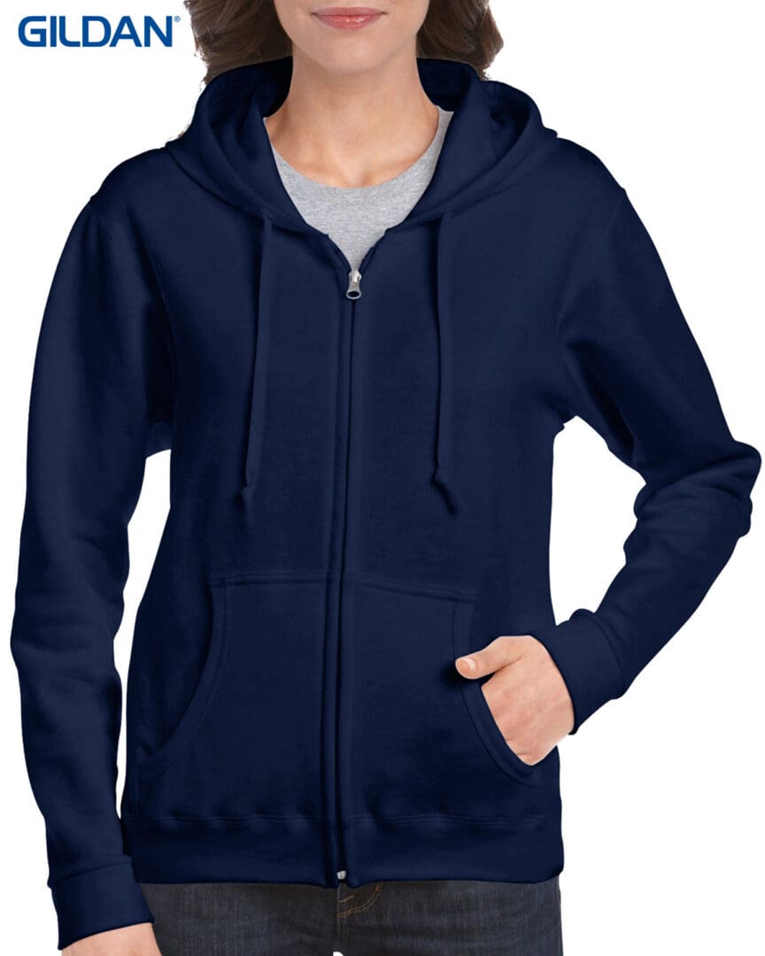 A woman wearing a navy blue hoodie with a gray shirt.