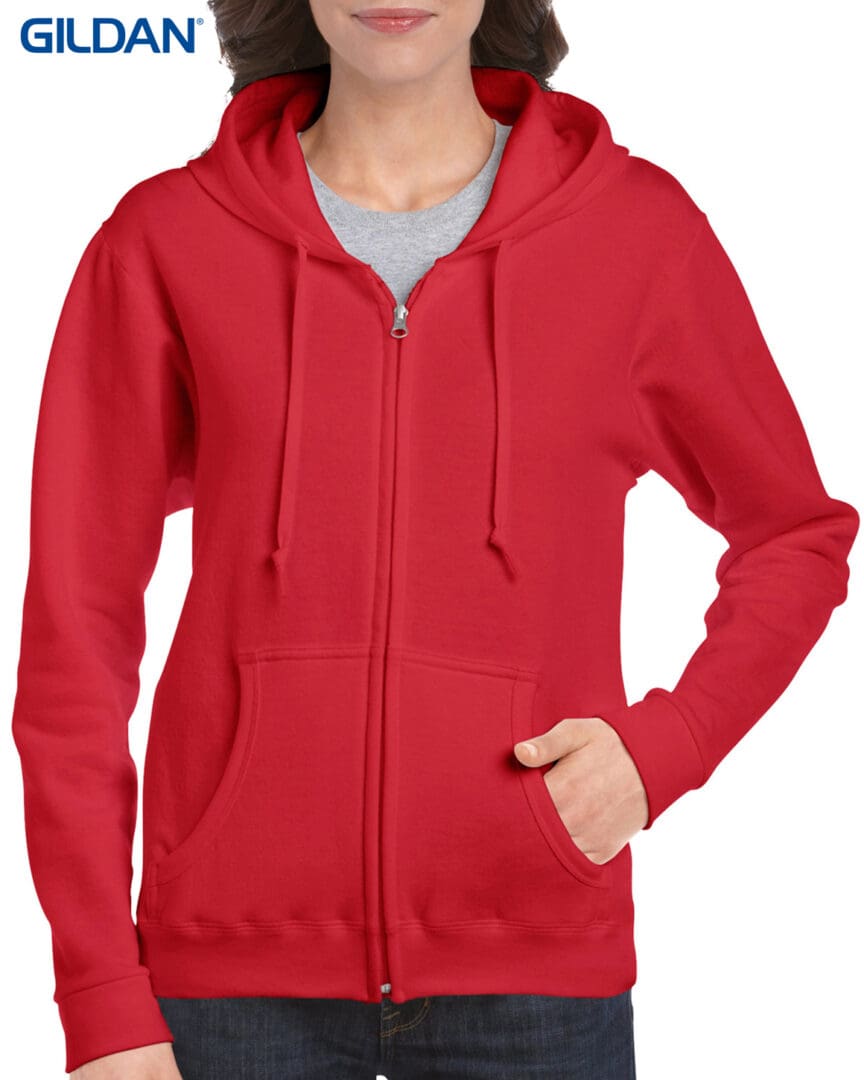 A woman wearing a red hoodie with a gray shirt