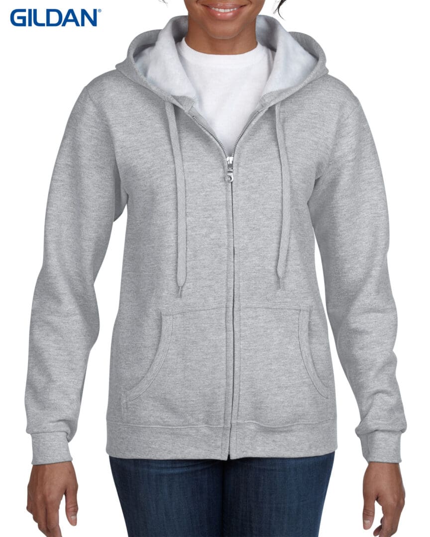 A woman wearing a gray hoodie with white trim.