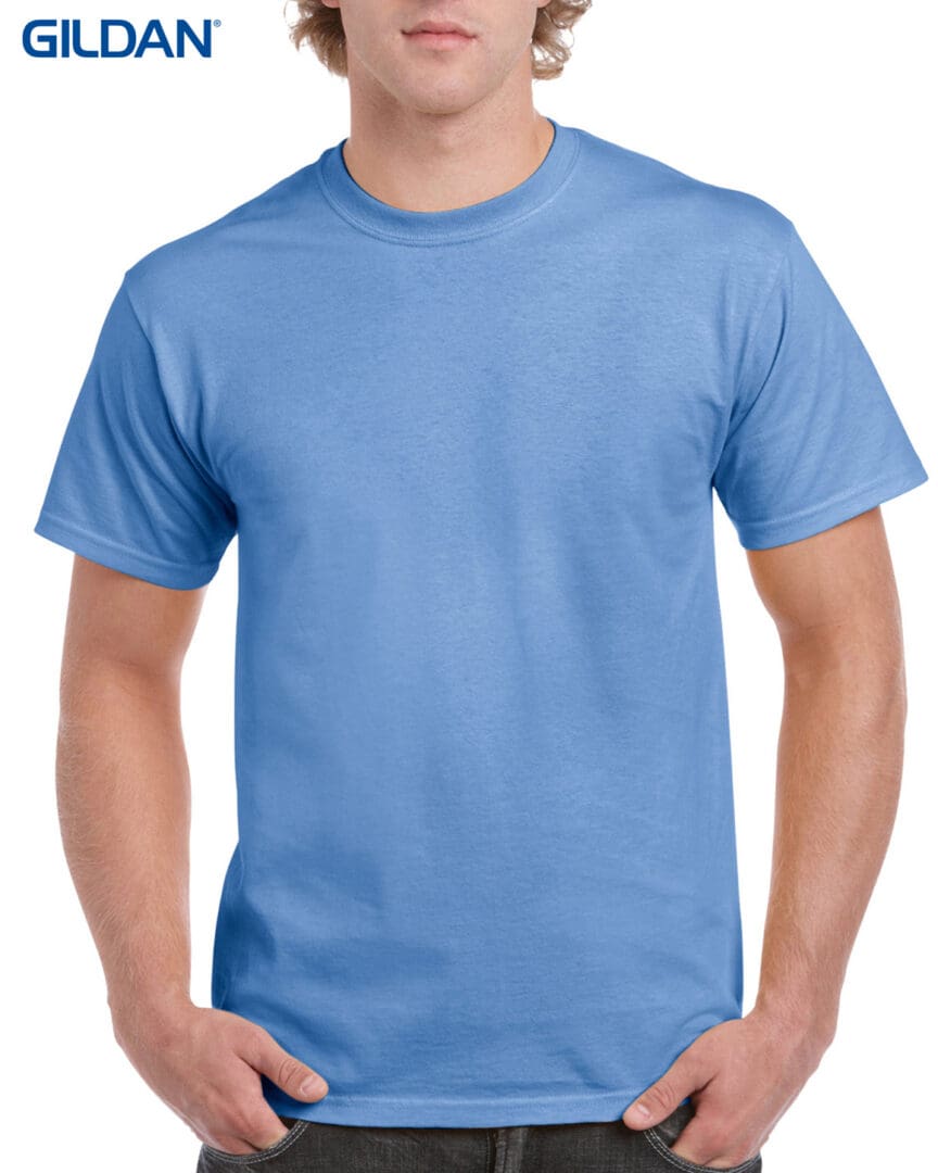 A man wearing a light blue t-shirt.