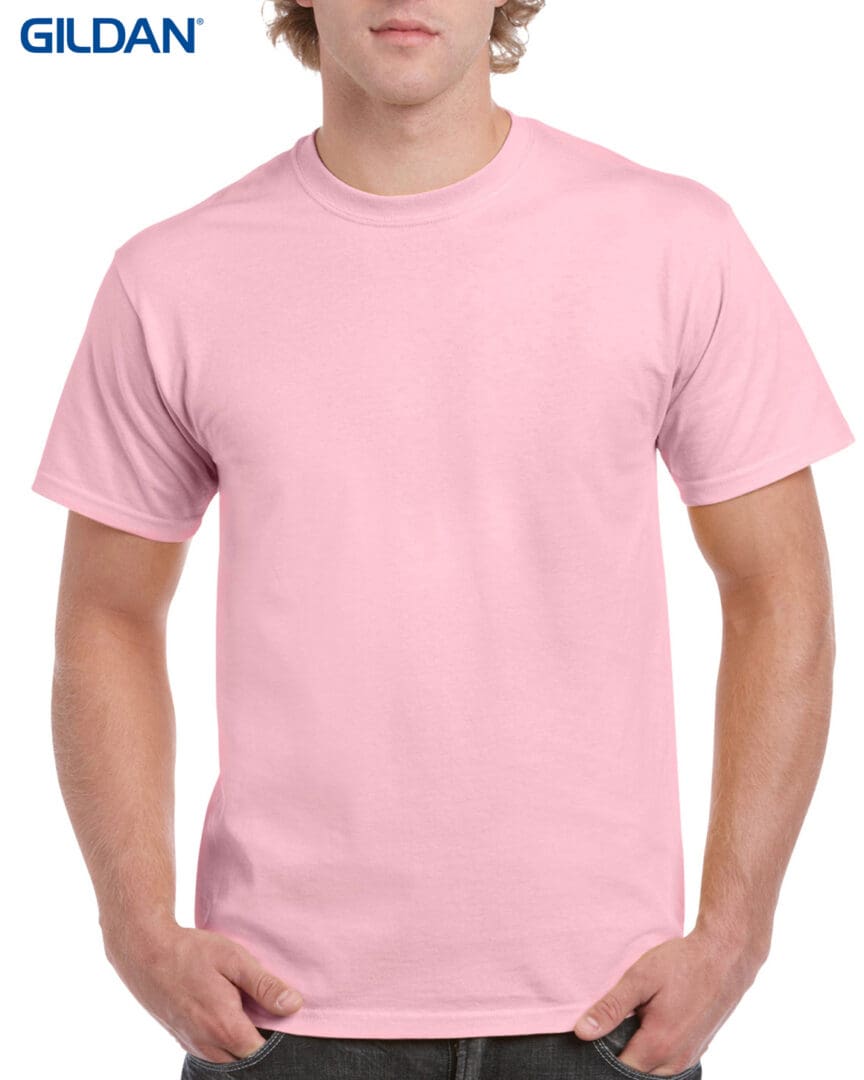 A man wearing light pink t-shirt with white background.