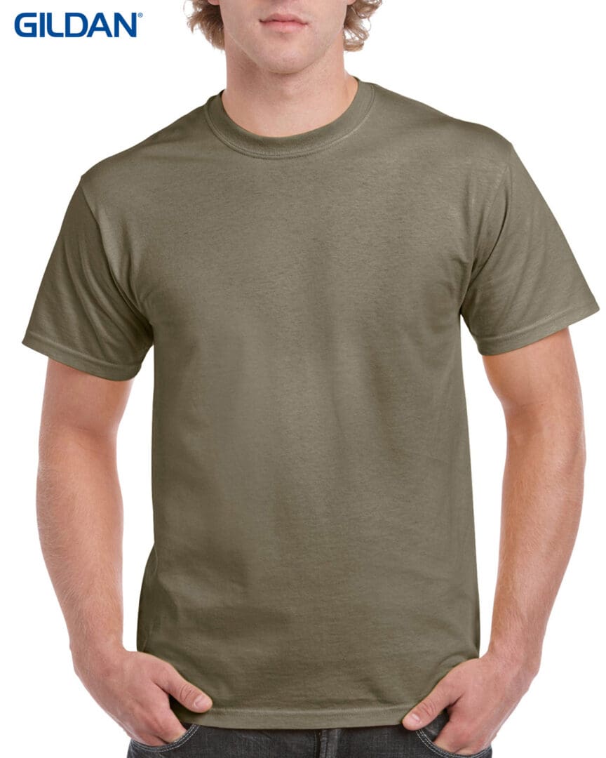 A man wearing a khaki colored t-shirt.