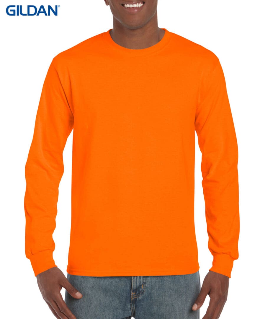 A man wearing an orange long sleeve shirt.