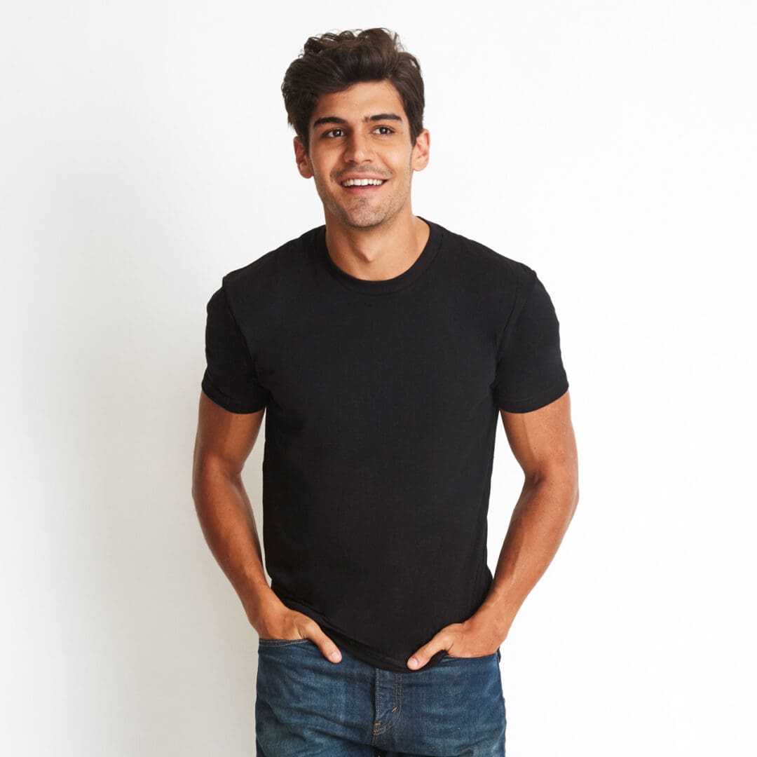 A man in black shirt and jeans posing for the camera.