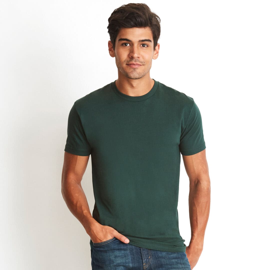 A man wearing jeans and green shirt