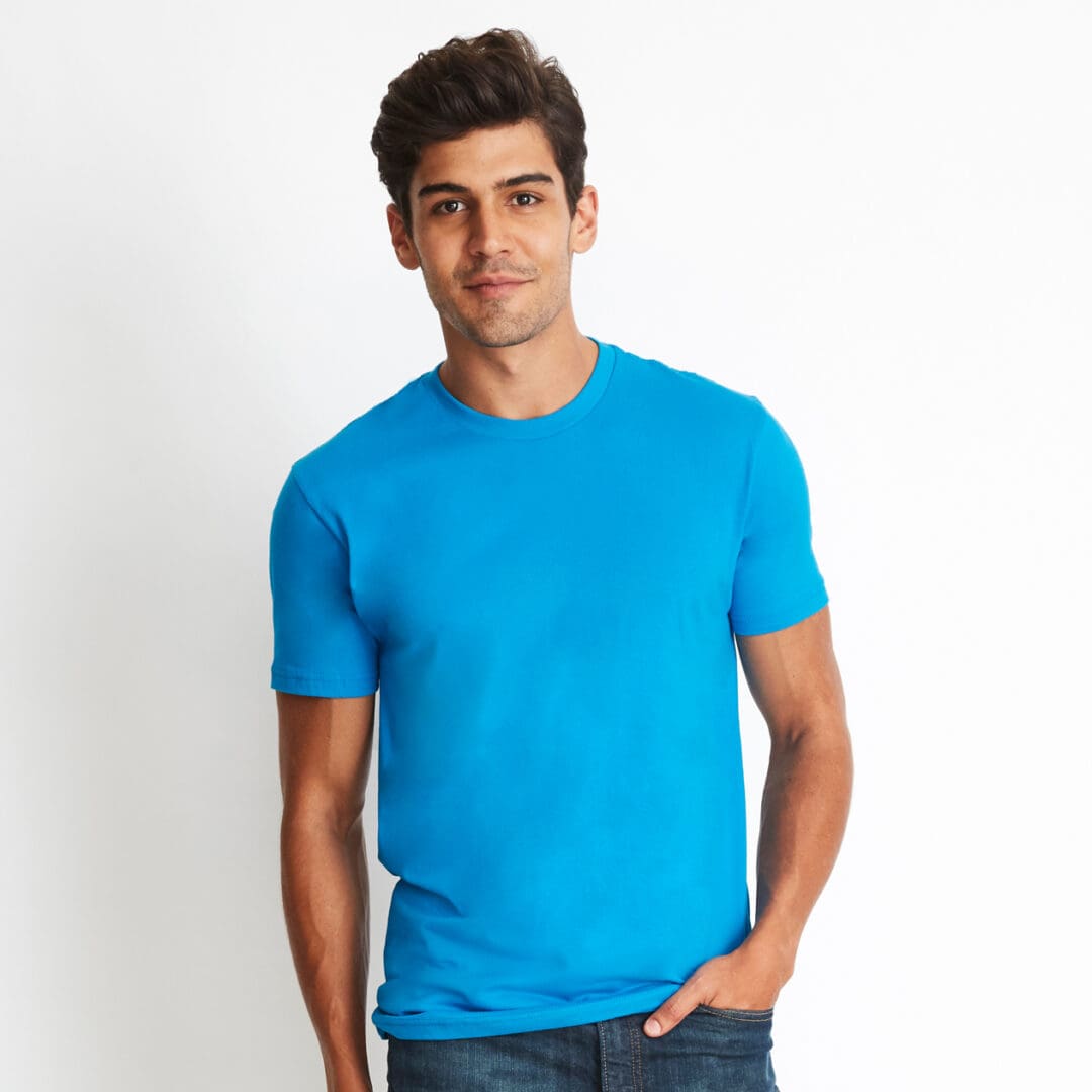 A man wearing a blue shirt and jeans.