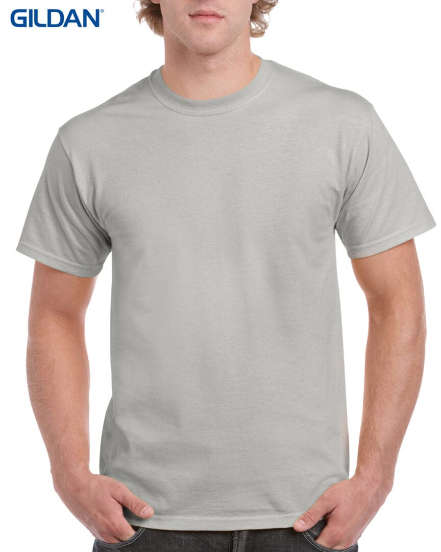 A man wearing a gray t-shirt with no background.