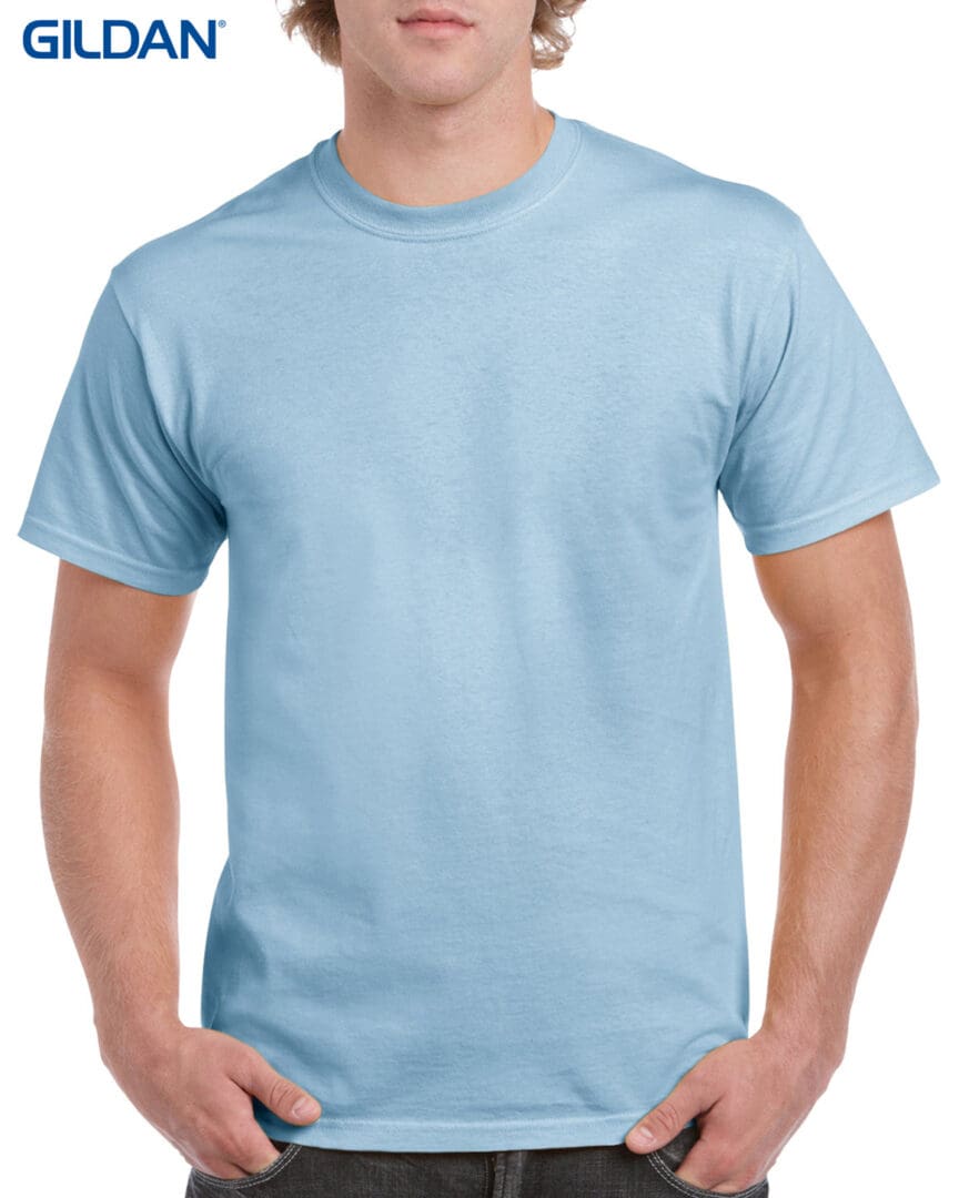 A man wearing light blue t-shirt with white background.