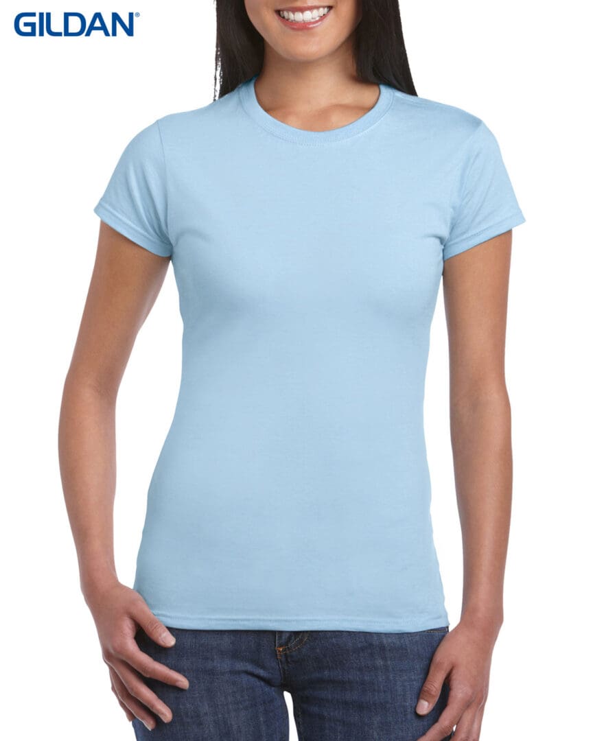 A woman wearing light blue t-shirt and jeans.