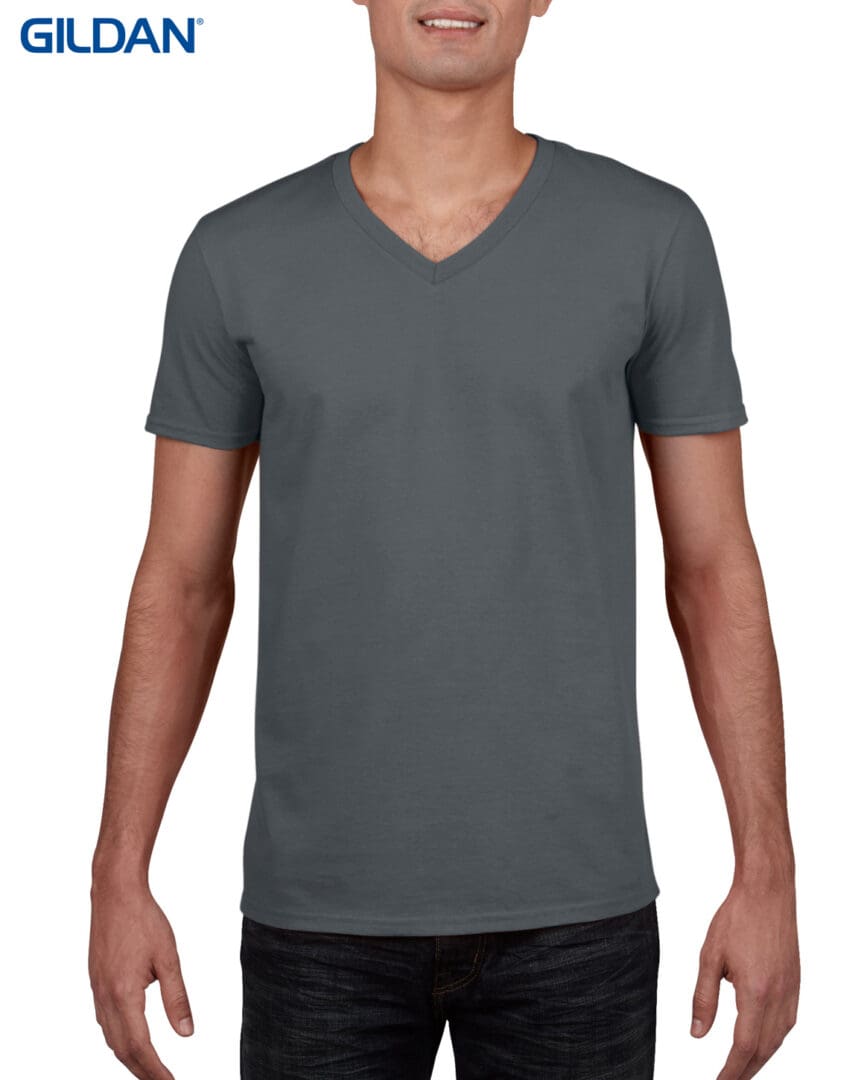 A man wearing a gray v neck shirt.