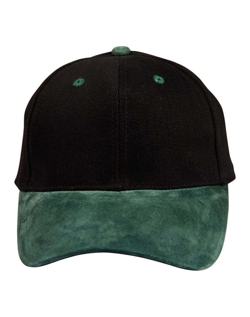 A black and green hat is on the ground