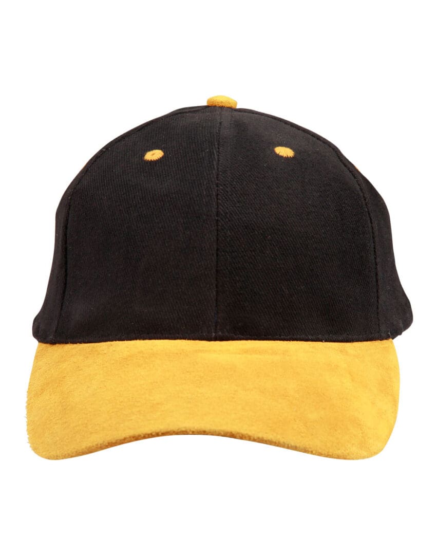 A black and yellow hat is on the ground