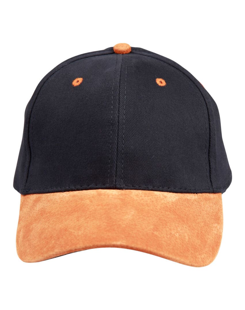 A black and orange hat is on the ground