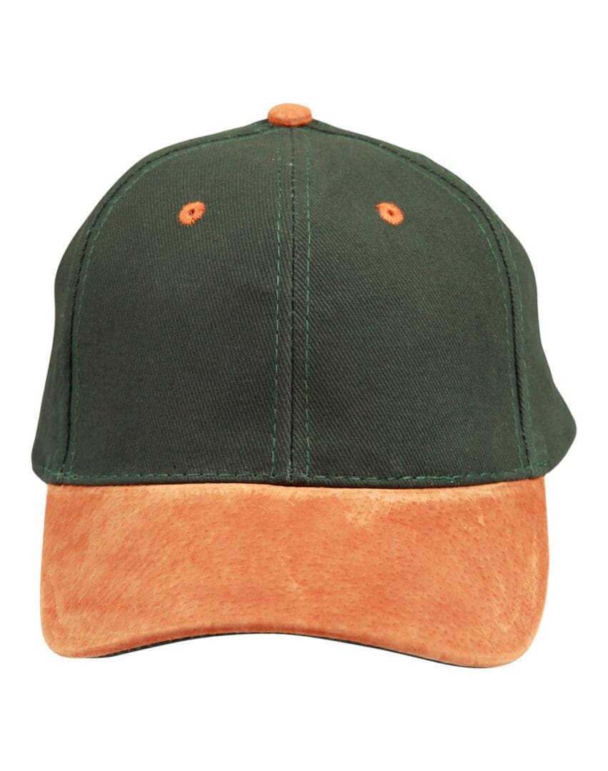 A green and orange hat is on the ground