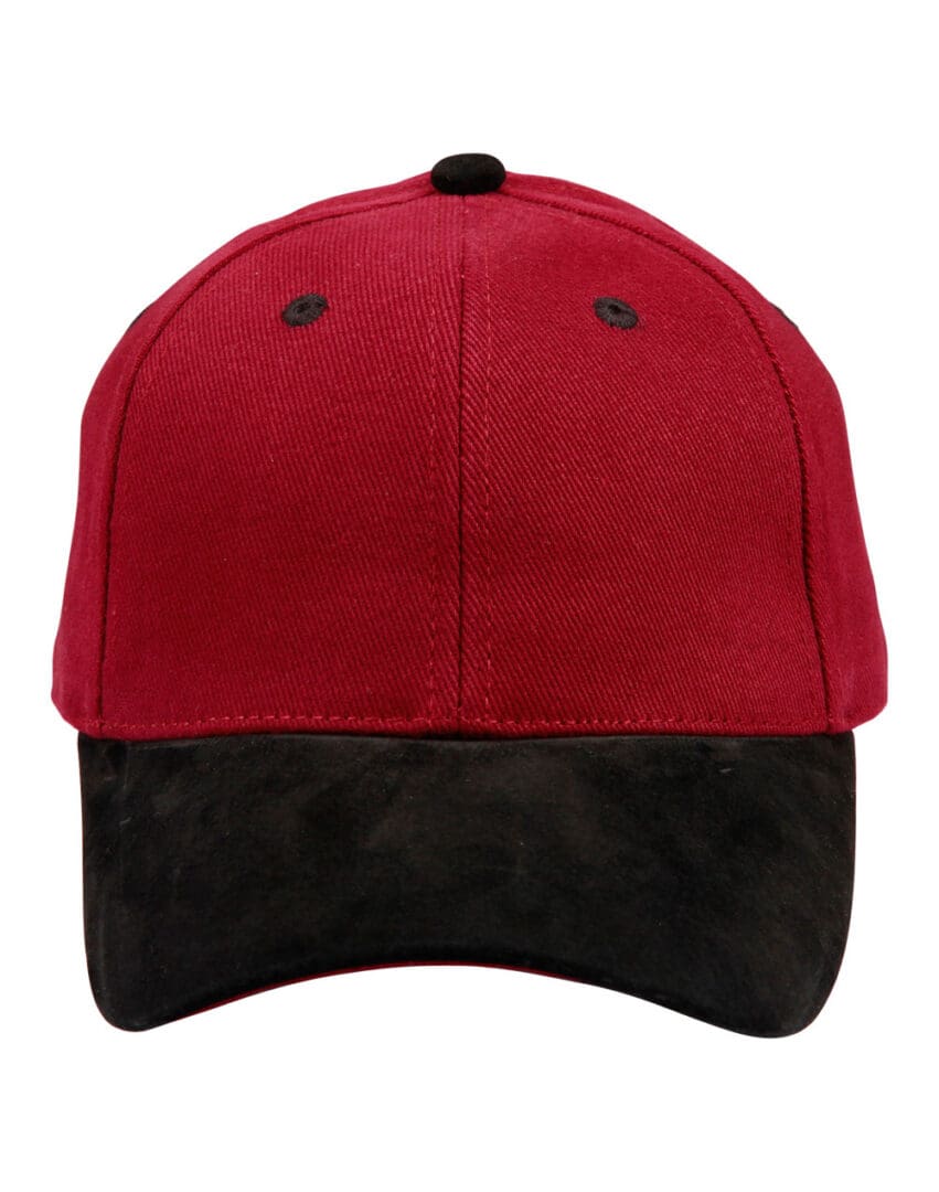 A red and black hat is on the ground