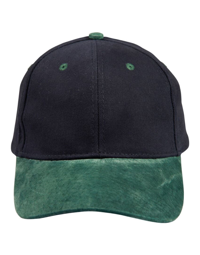 A black and green hat is on the ground