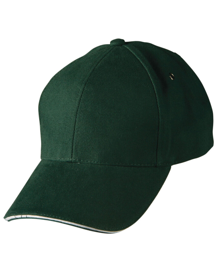 A green baseball cap with white trim on top of it.