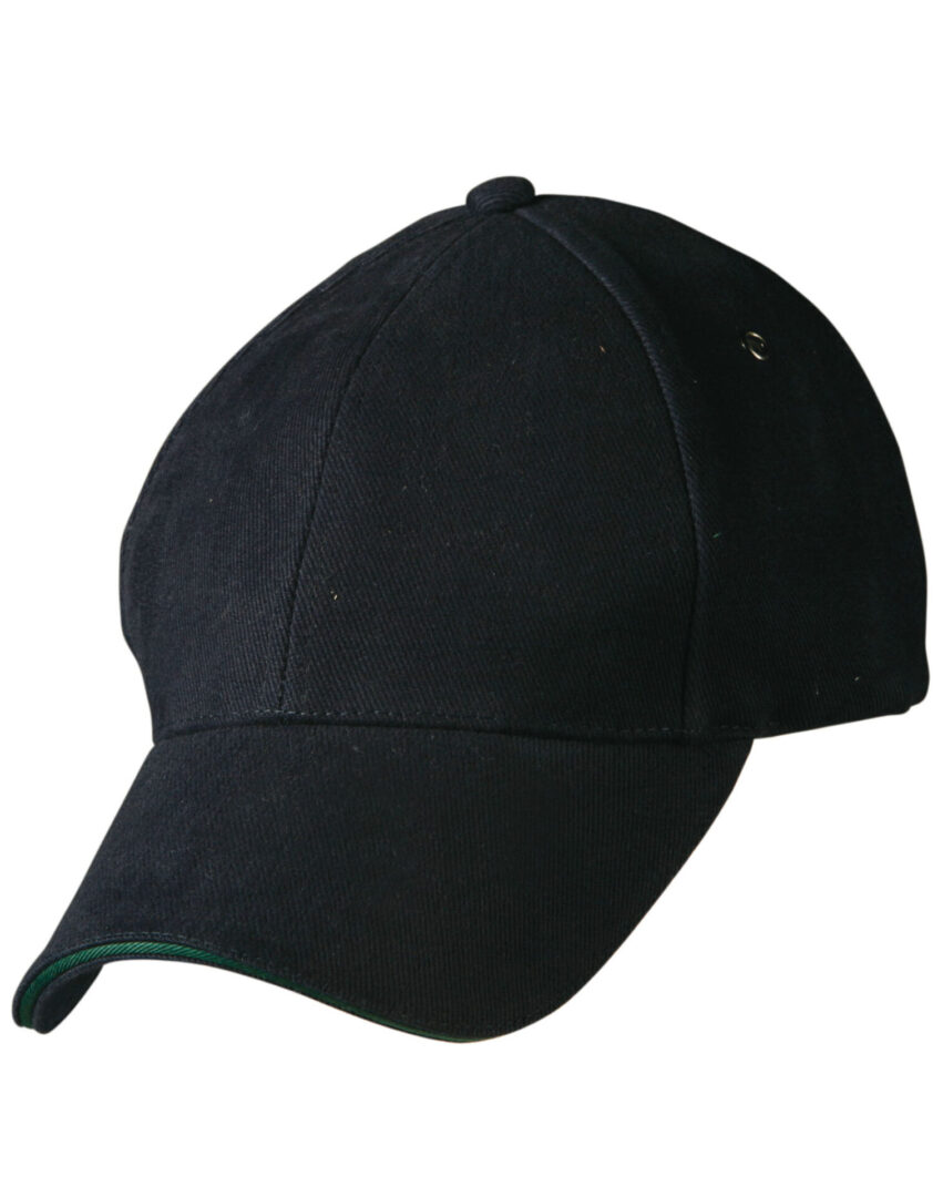 A black hat with green trim on top of it.