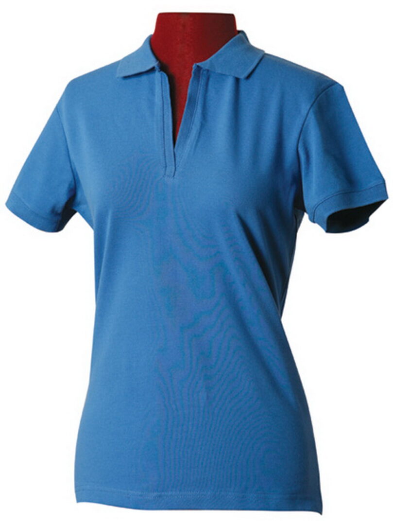 A woman wearing a blue polo shirt and red cap.